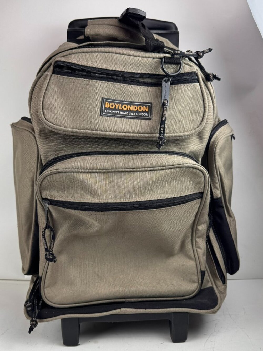 boy london rolling backpack tan wheeled suitcase travel bag tear fraying flaw